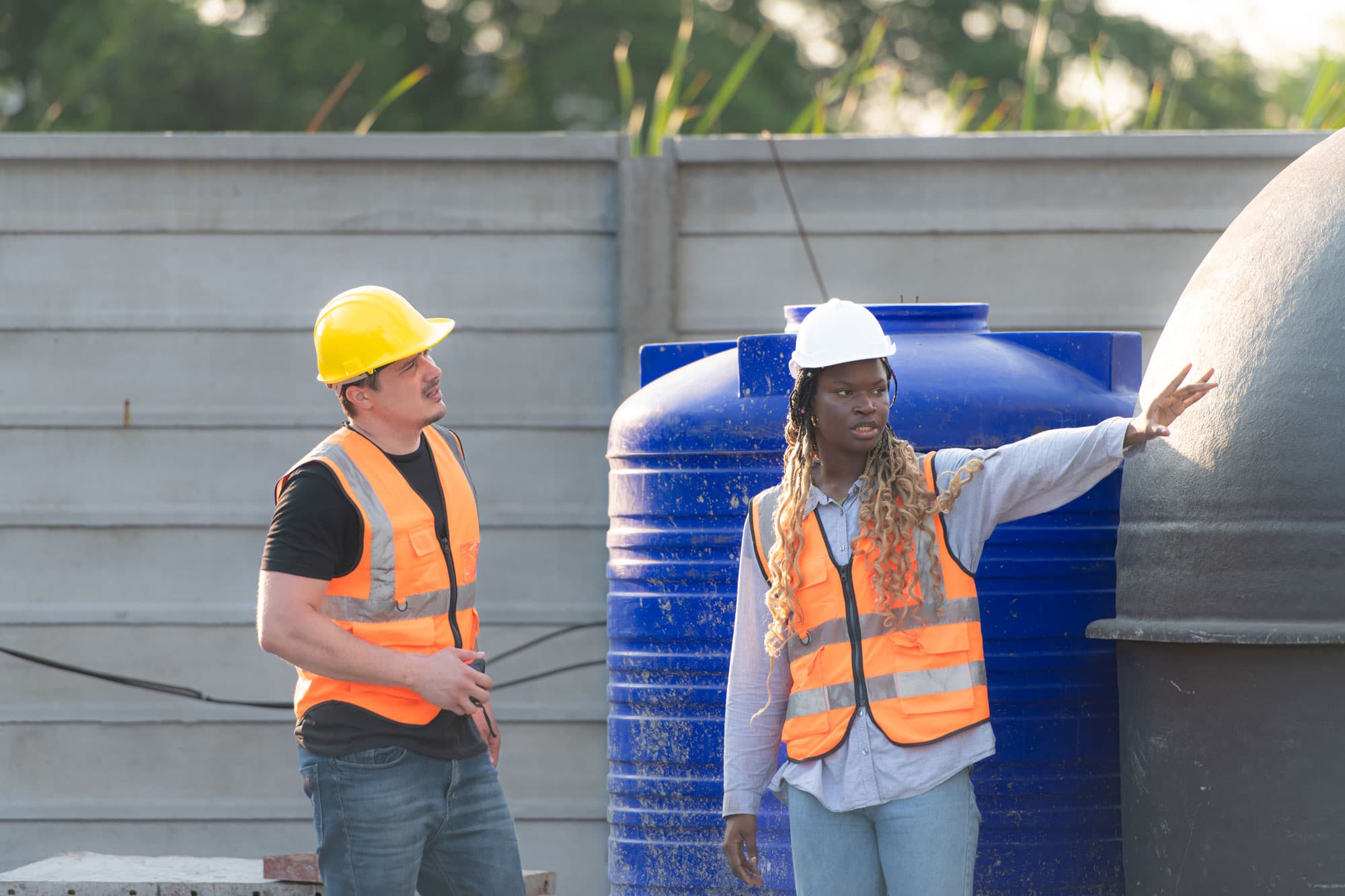 Workers and inspectors at septic site